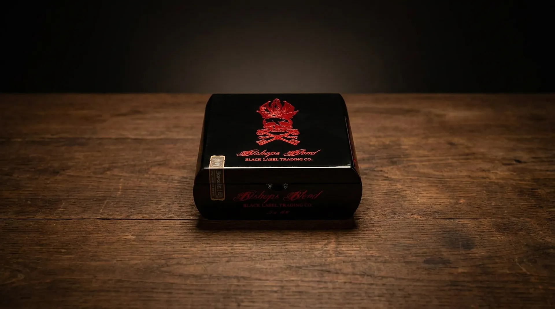 Black Label Trading Co. Bishops Blend 10th Anniversary cigar box, black lacquer with a red skull and crossed-keys crest