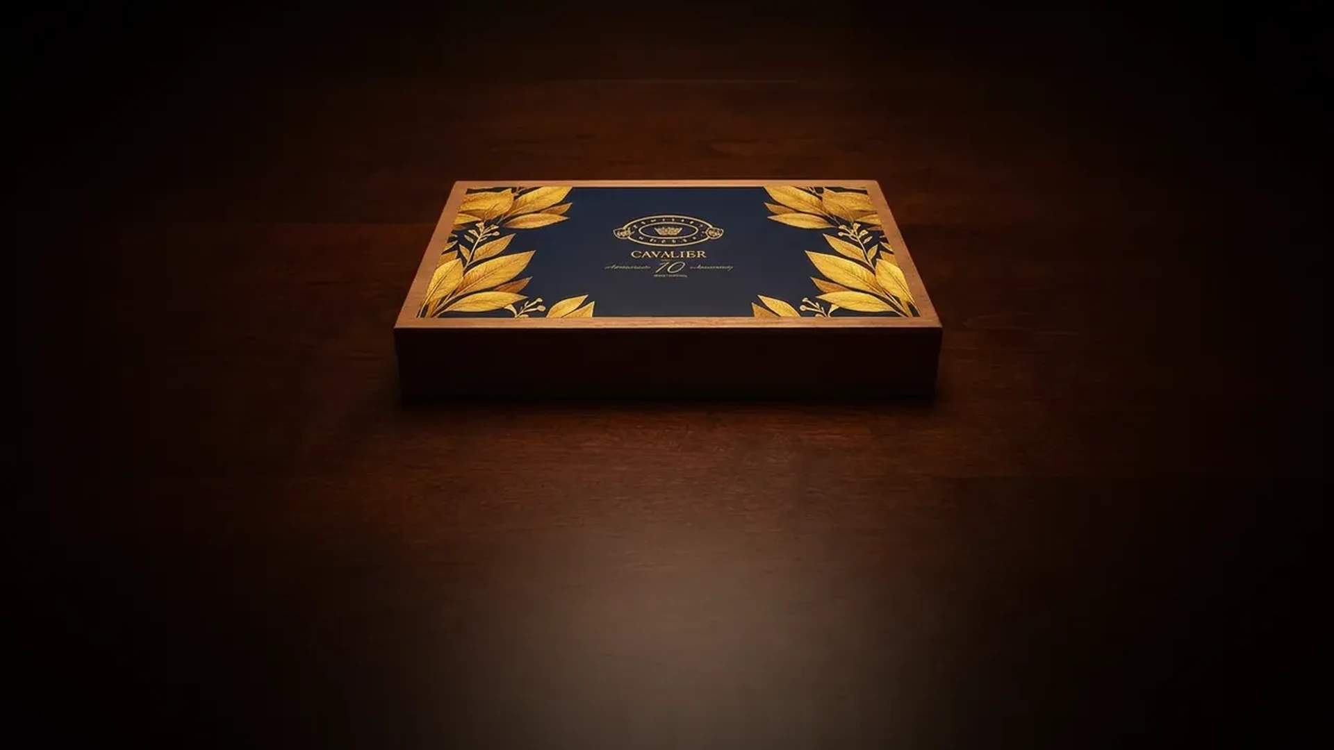 Cavalier Genève 10 Years Crafting cigar box, navy lid with gold tobacco-leaf border and the Cavalier crest