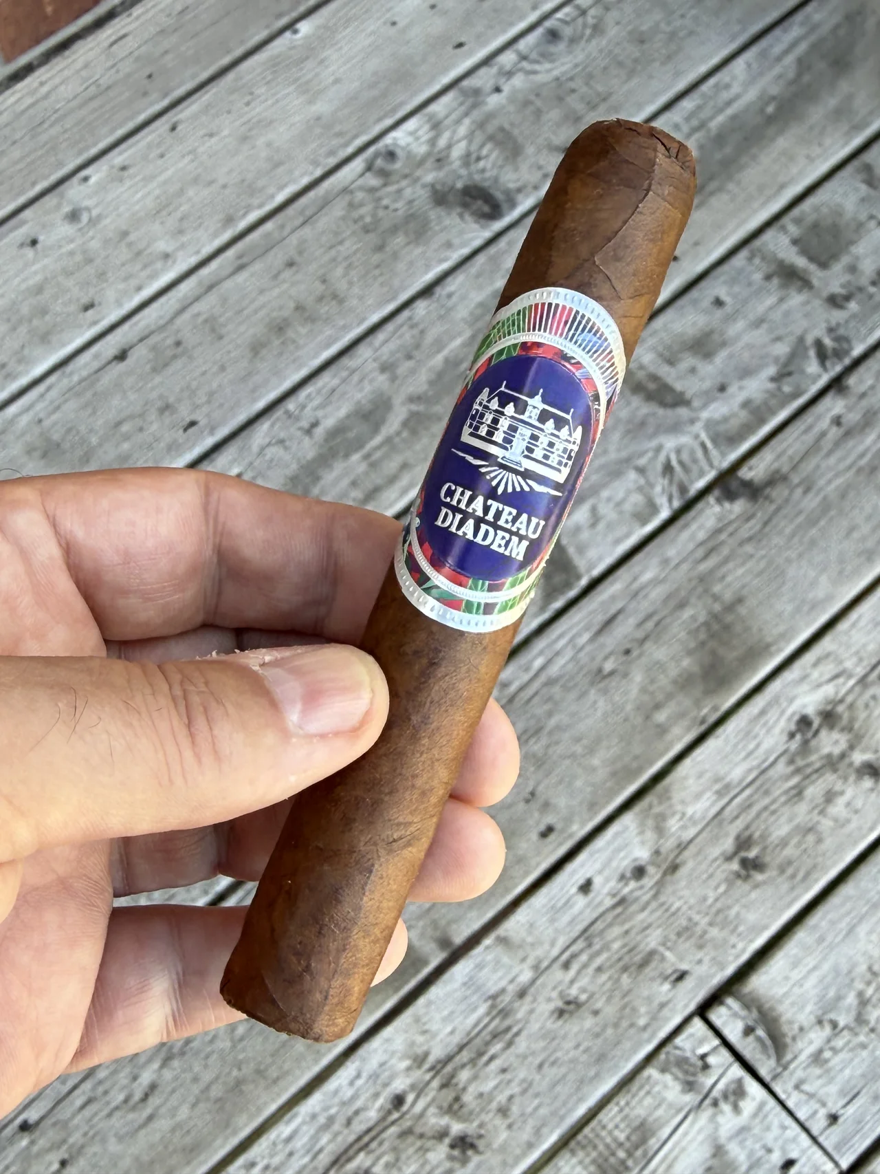 Norm Farrar holding the Chateau Diadem Certitude Toro on the porch