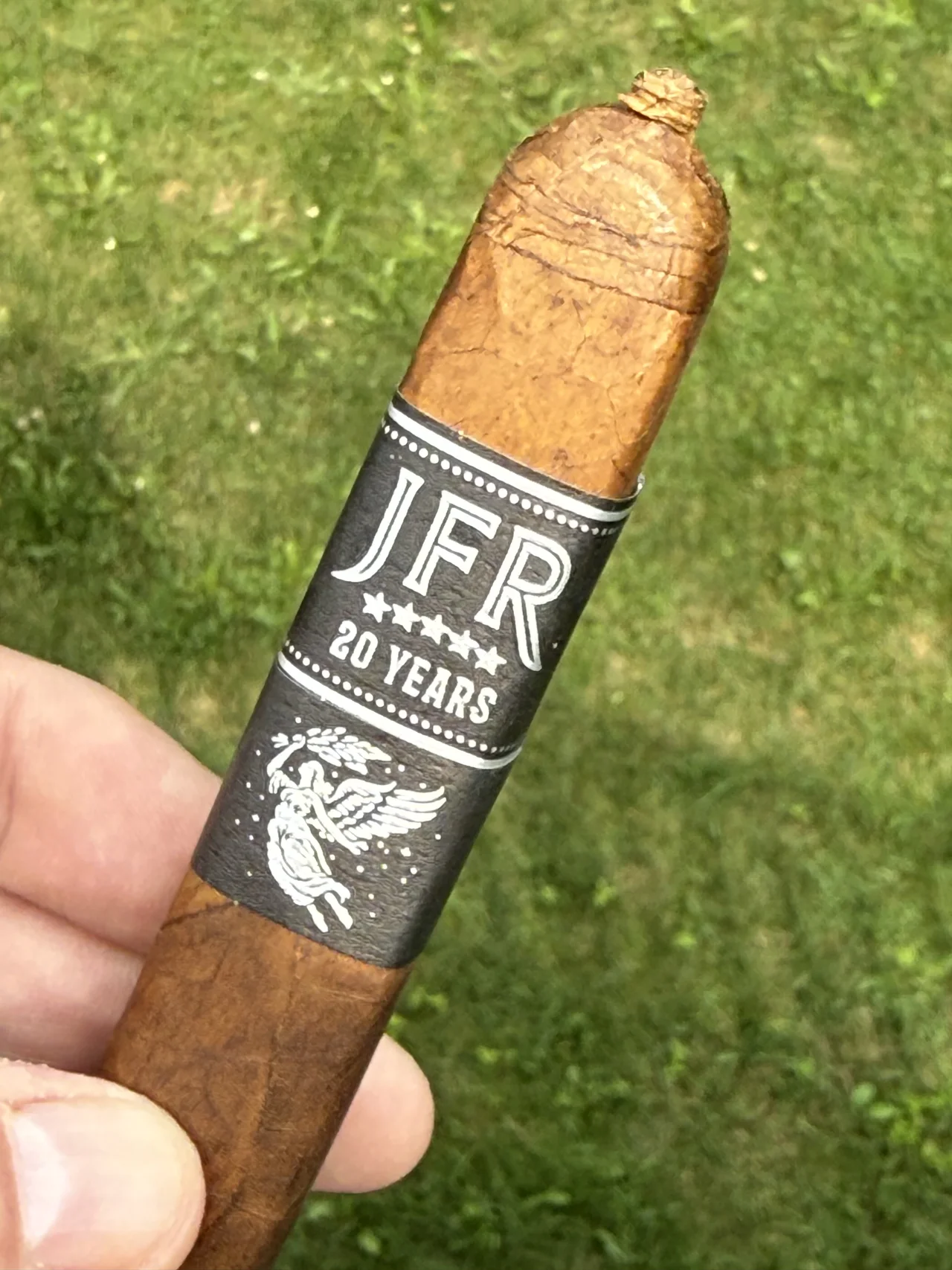 Close-up of the JFR 20th Anniversary band and pigtail cap