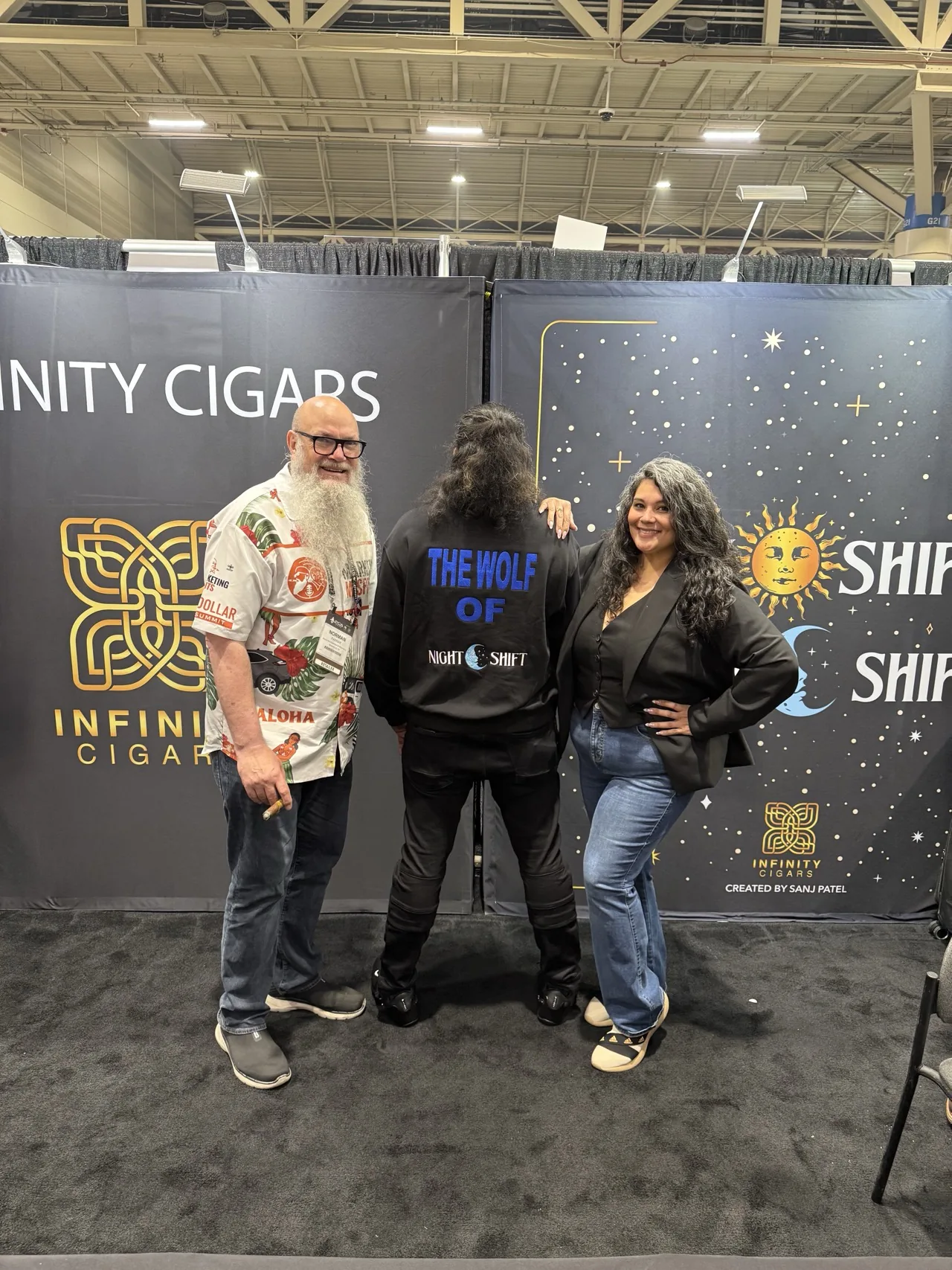 Norm Farrar with Infinity Cigars co-owner Sanj Patel and Melanie Libretto at the Infinity Cigars booth