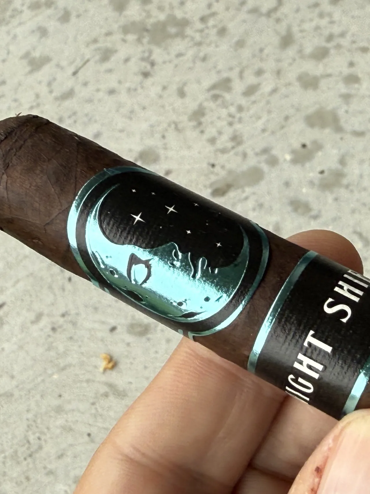 Close-up of the Infinity Night Shift Toro, maduro wrapper and crescent moon band