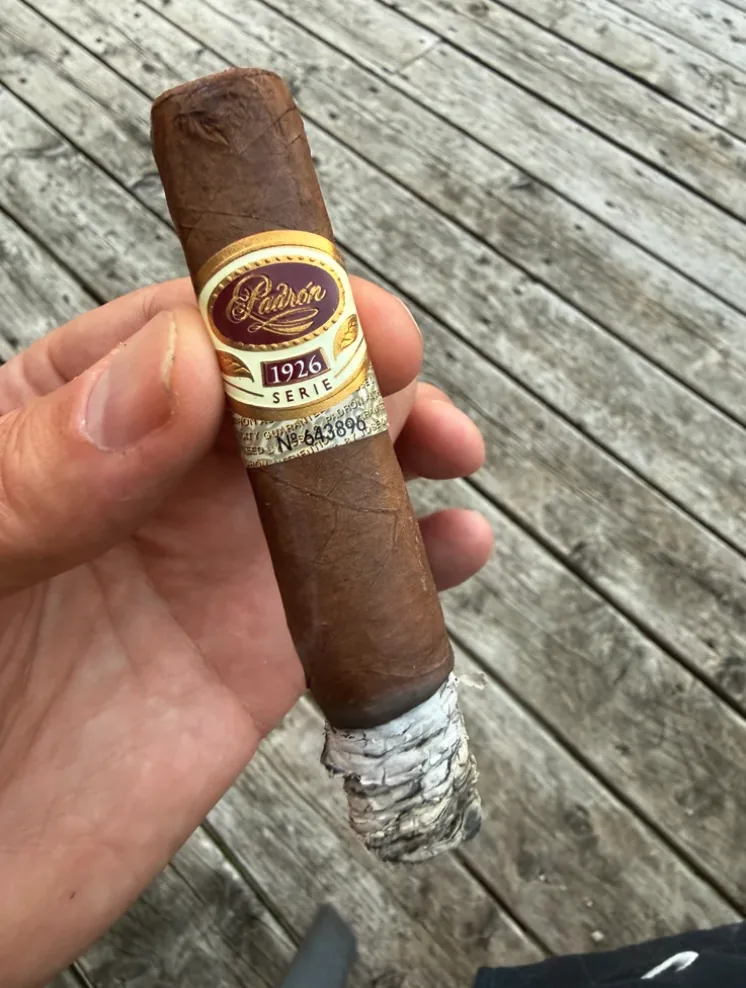 Padron 1926 Serie No. 35 Natural in hand on Norm's deck with two inches of stacked gray ash