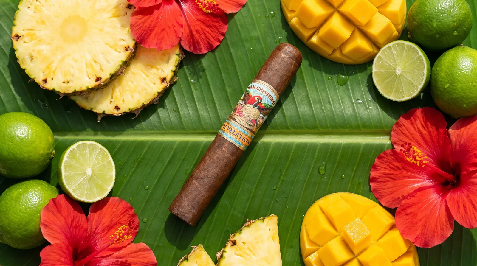 The San Cristobal Revelation cigar on a banana leaf with pineapple, mango and hibiscus